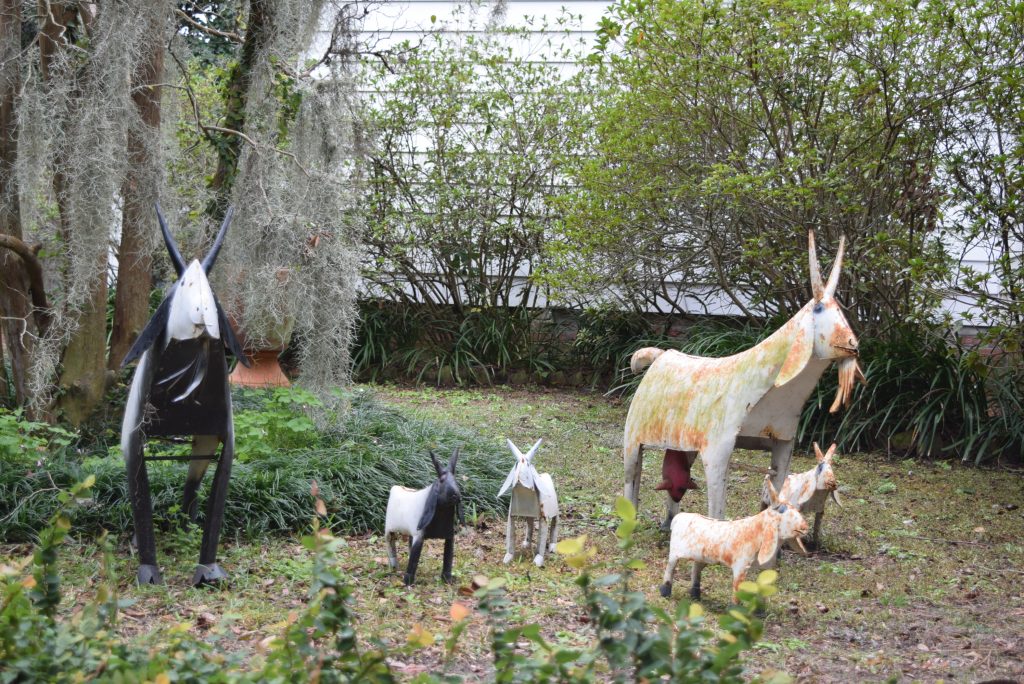 Cute farm animals in front yard of historic home