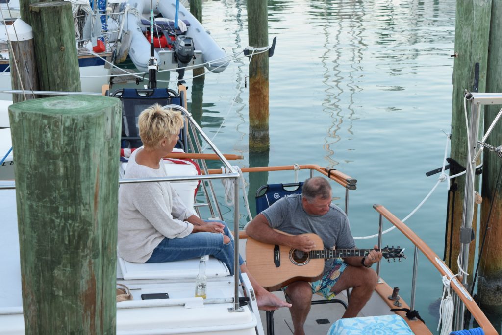 Donnie playing and singing while Michelle admires